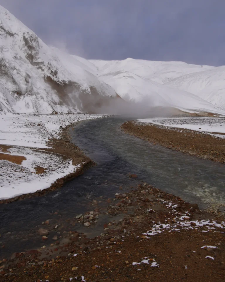 A steaming river winding through the geothermal valley of Hveradalir in Kerlingarfjöll, Iceland