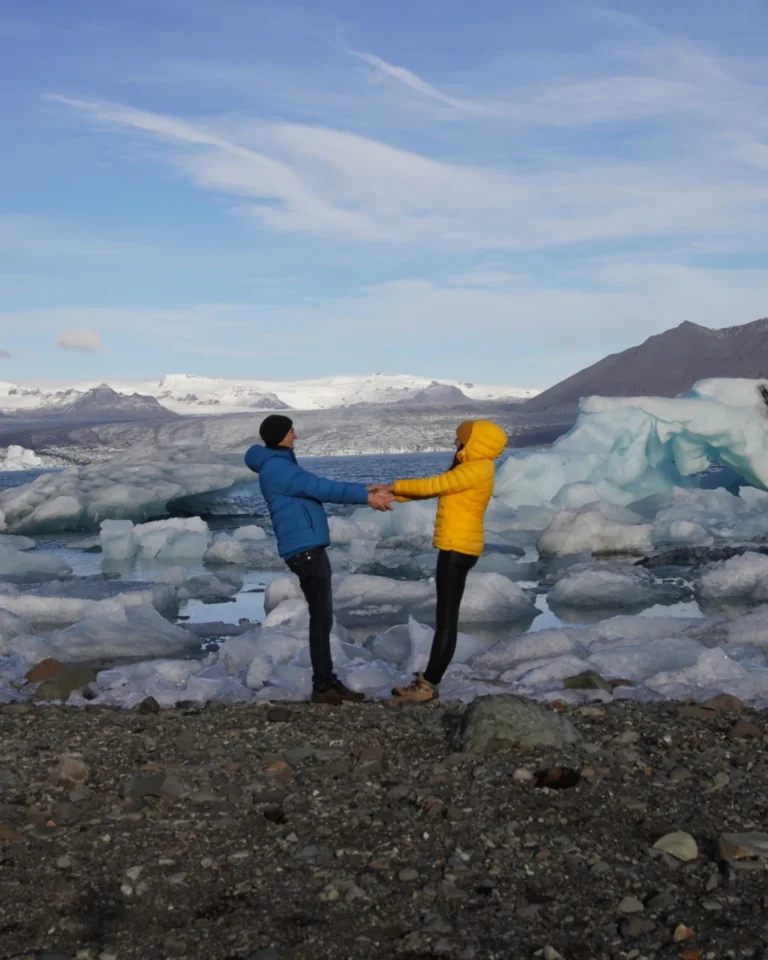 Diamond Beach in Iceland during the daytime, with ice chunks sparkling on the black sand beach