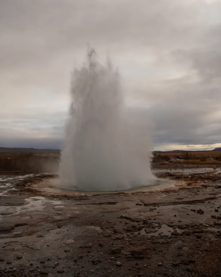 Strokkur Geysir erupting with a powerful jet of boiling water in Haukadalur, Iceland