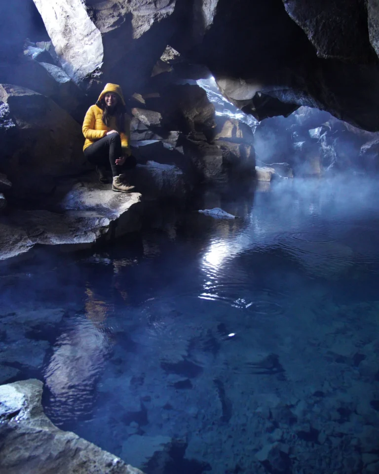 Inside Grótagjá, a hot cave near Lake Mývatn, Iceland, with warm steam rising from the geothermal waters