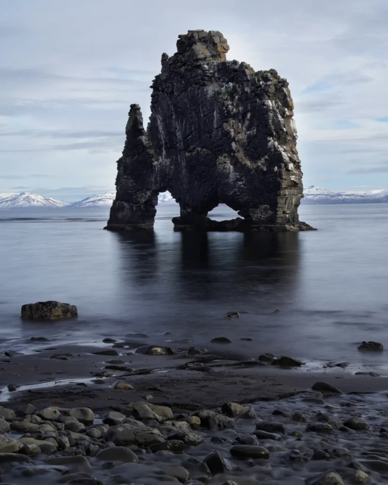 Hvítserkur rock formation captured in a long-exposure shot with smooth water, Iceland