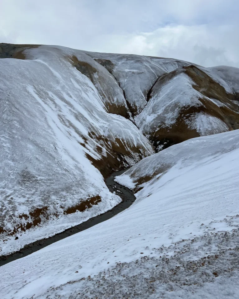 A panoramic view of Hveradalir with snow-covered mountains in the background, Kerlingarfjöll, Iceland