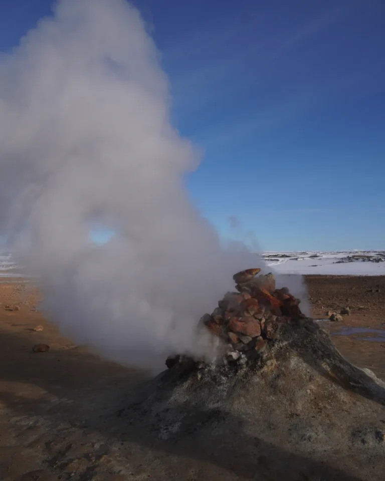 Steam emerging from a rock at Mývatn geothermal area, Iceland, showcasing the natural geothermal activity