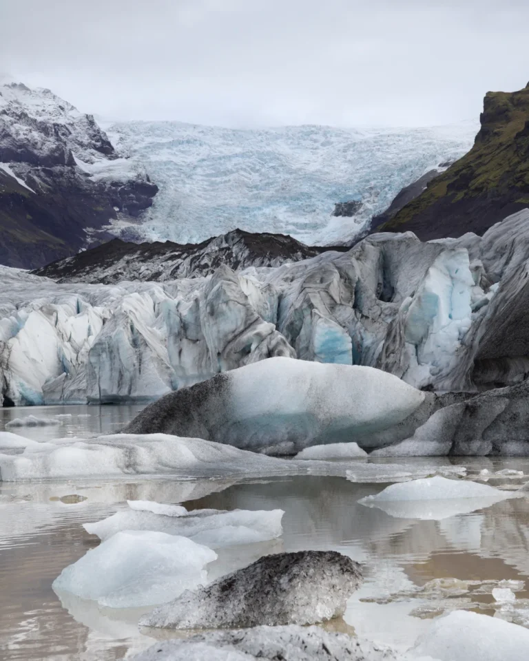 View of Vatnajökull Glacier with the tranquil Vatnajökull Lake in the foreground, and the glacier tongue in the distance, Iceland