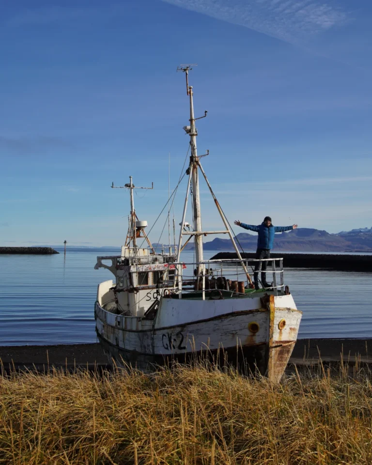 The Sæljós GK 2 shipwreck, resting on the shore with its rusted hull in Iceland