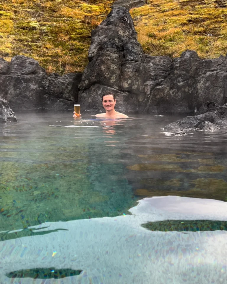 Person enjoying the warm waters of Sky Lagoon, Reykjavík, Iceland