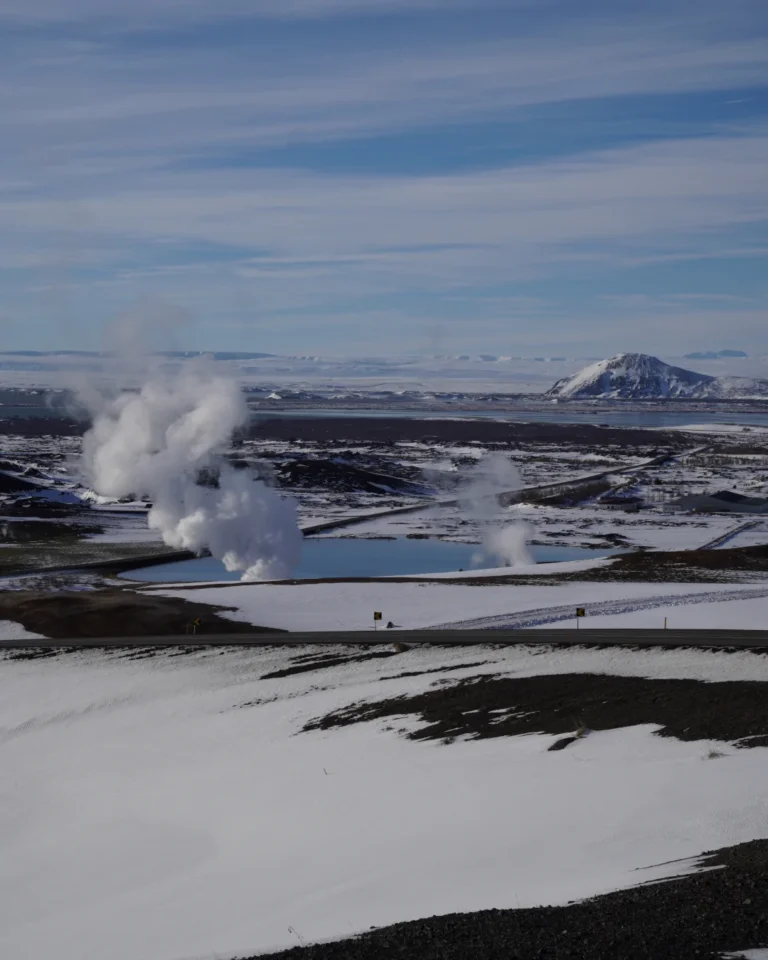 Steam emerging from the ground at the geothermal power plant in Mývatn, Iceland