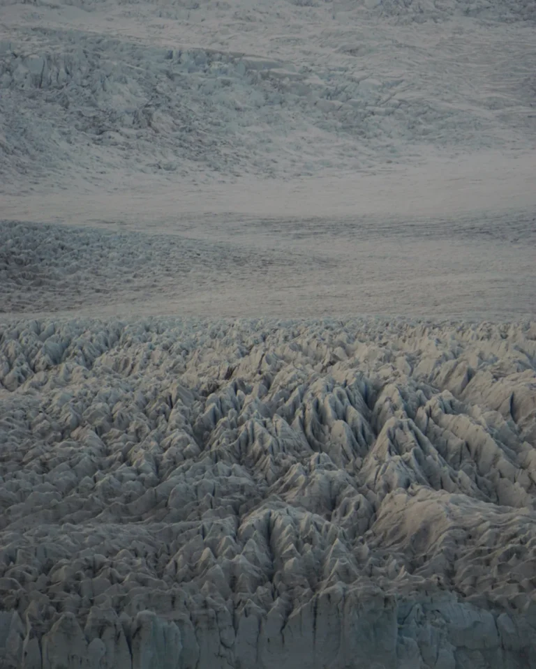 Aerial view above the Vatnajökull Glacier, showcasing the razor-sharp ice formations on the glacier's surface, Iceland