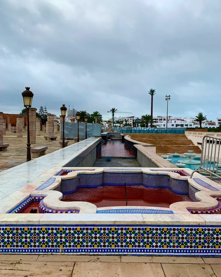 Ornate blue and white mosaic fountain at the Hassan Tower square in Rabat.