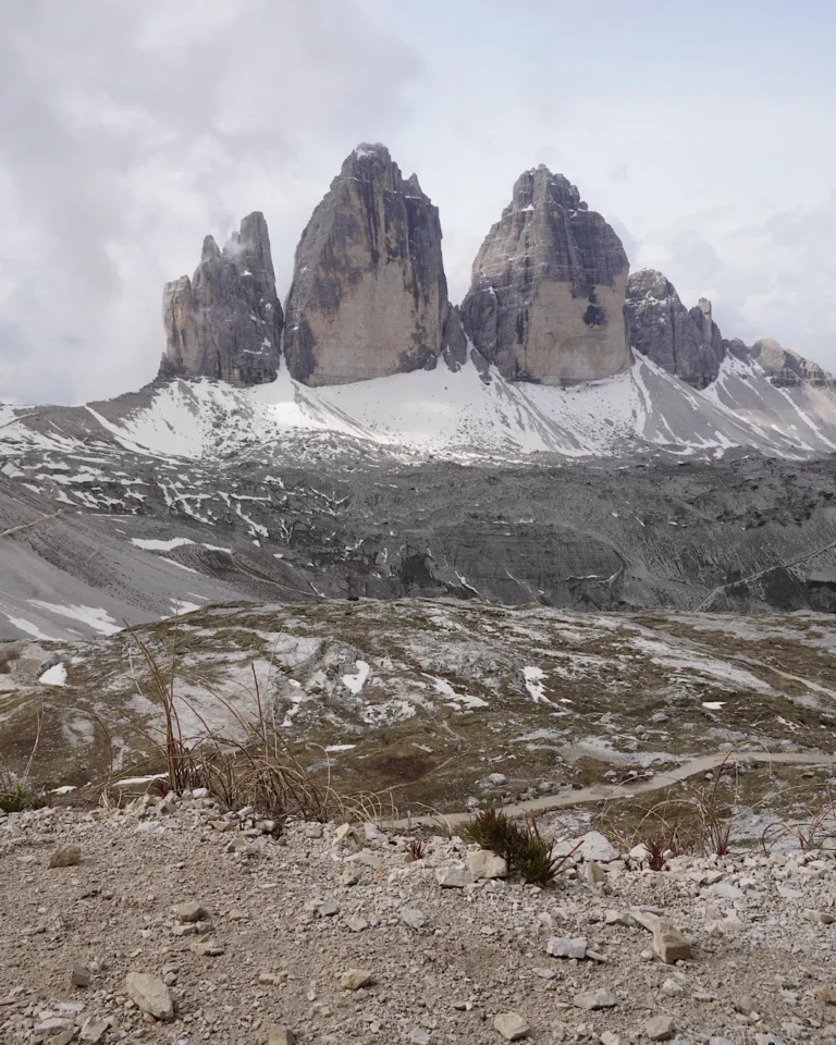 Panoramic view of the Tre Cime di Lavaredo and surrounding hiking trails in the Italian Dolomites.