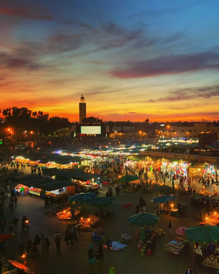 Djemaa el Fna at night with Koutoubia Mosque in the background.