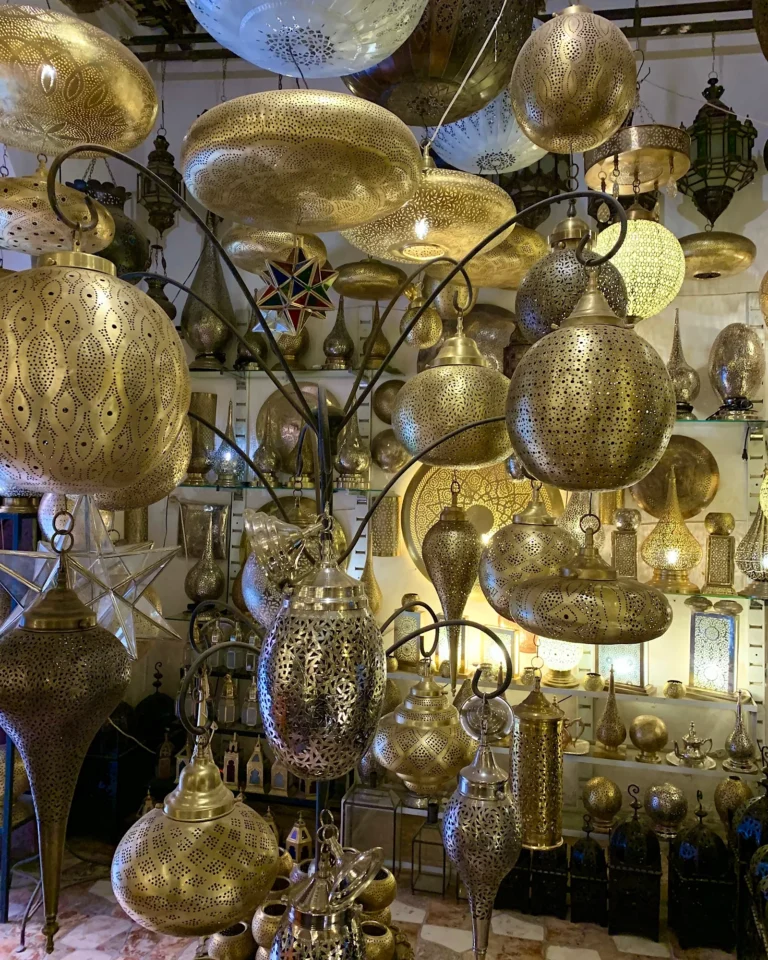 Ornate golden Moroccan metal lanterns in various shapes.