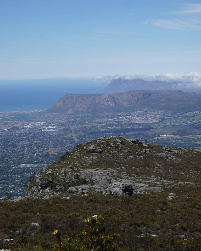 Vast panoramic view from Table Mountain over the surrounding areas of Cape Town.