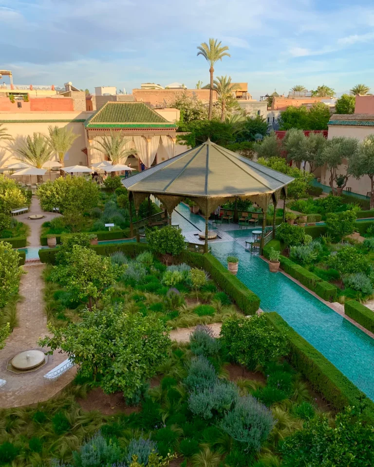 Top view of Le Jardin Secret with pavilion and green tiled paths.