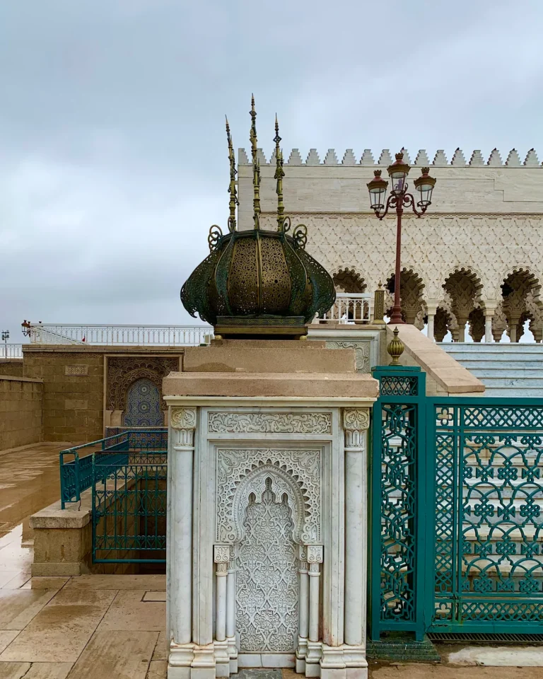 Ornate golden column shaped like a crown at the Mausoleum of Mohammed V in Rabat.