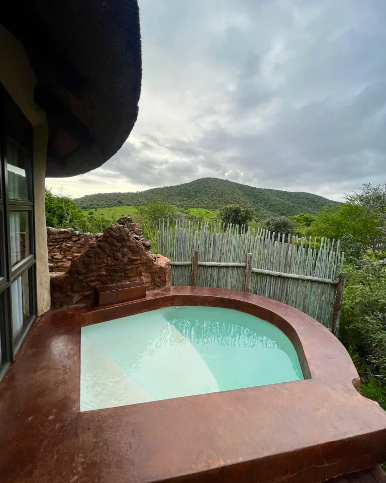 Private outdoor pool at Nyathi Rest Camp with views of the savannah and wildlife in Addo Park.