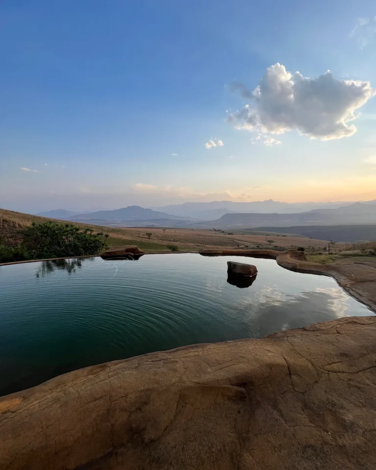 Naturally designed pool at Berghouse and Cottages at sunset in Royal Natal National Park.