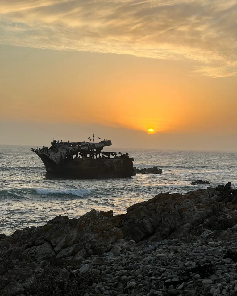 Shipwreck at Cape Agulhas during sunset at the southernmost tip of Africa.