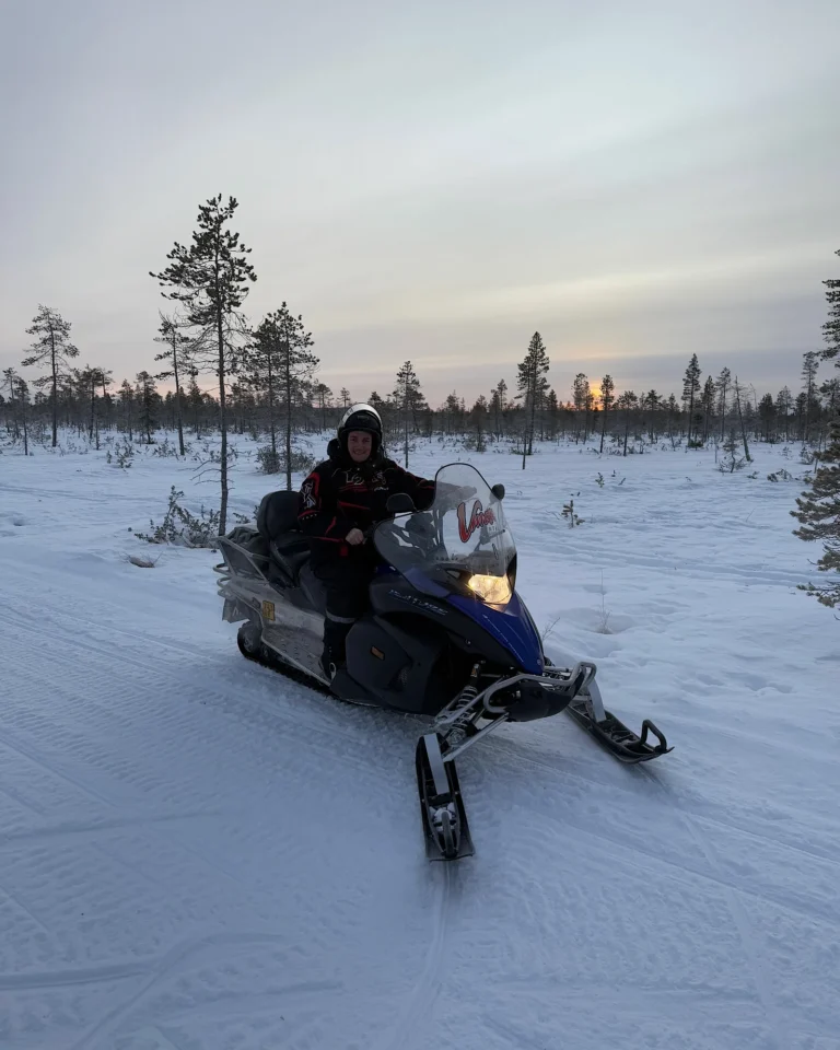 Modern snowmobile from Vmax Rentals in the deep snow in Finland.