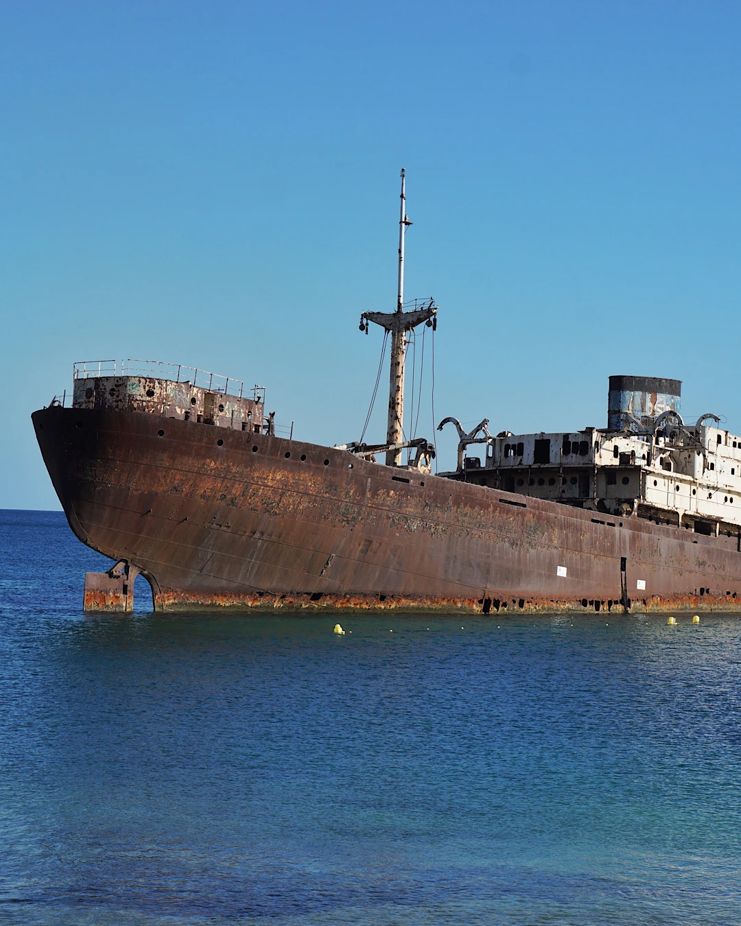 The stranded shipwreck Barco Fantasma (Telamon) in the ocean near Arrecife, Lanzarote.