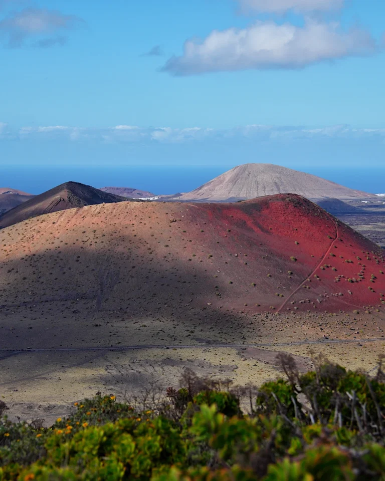 The bright red volcano Montaña Colorada during a hike in Lanzarote.